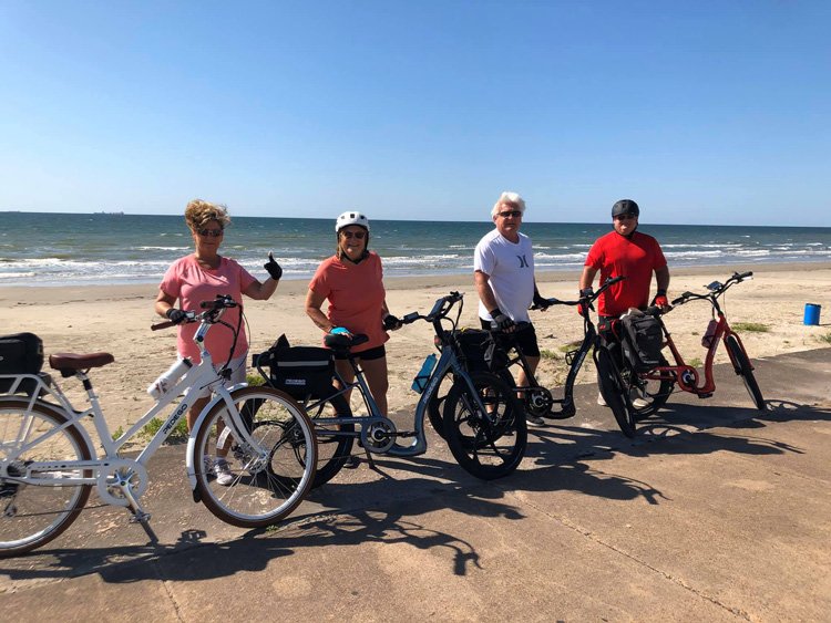 Pedego riders on the Seawall boardwalk in Galveston.