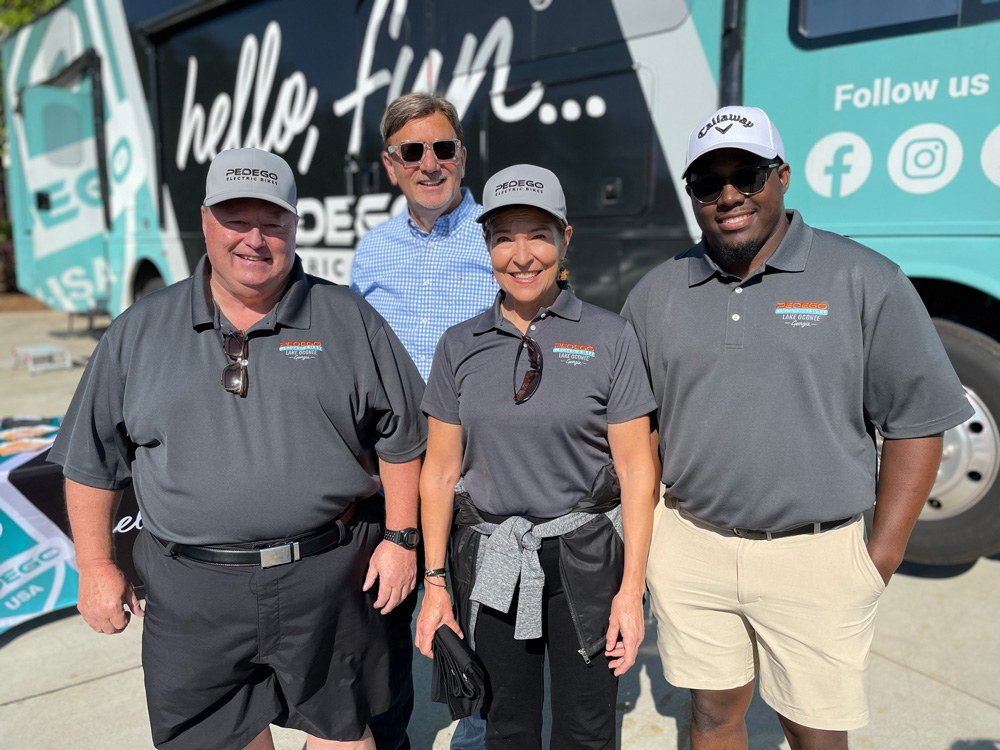 Owner of Pedego Lake Oconee, Mike, and team with Pedego CEO, Don DiCostanzo.