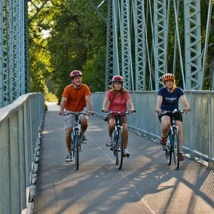 Family riding their Pedego Electric Bikes.