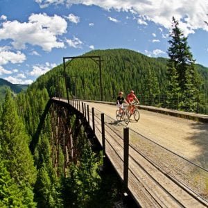 Pedego Rails to Trail vacation-- two people riding Pedego Electric Bikes.