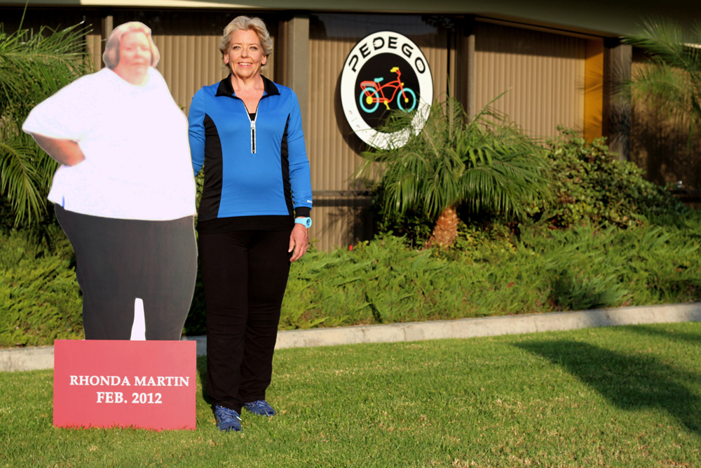 Rhonda Martin standing outside of the Pedego main office showcasing her weight loss journey.