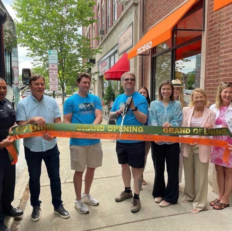 Owner of Pedego Winnetka, Scott Radliff, cutting the ribbon at his Grand Opening event.