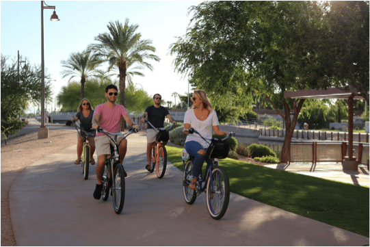 Friends riding Pedego electric bikes in Scottsdale